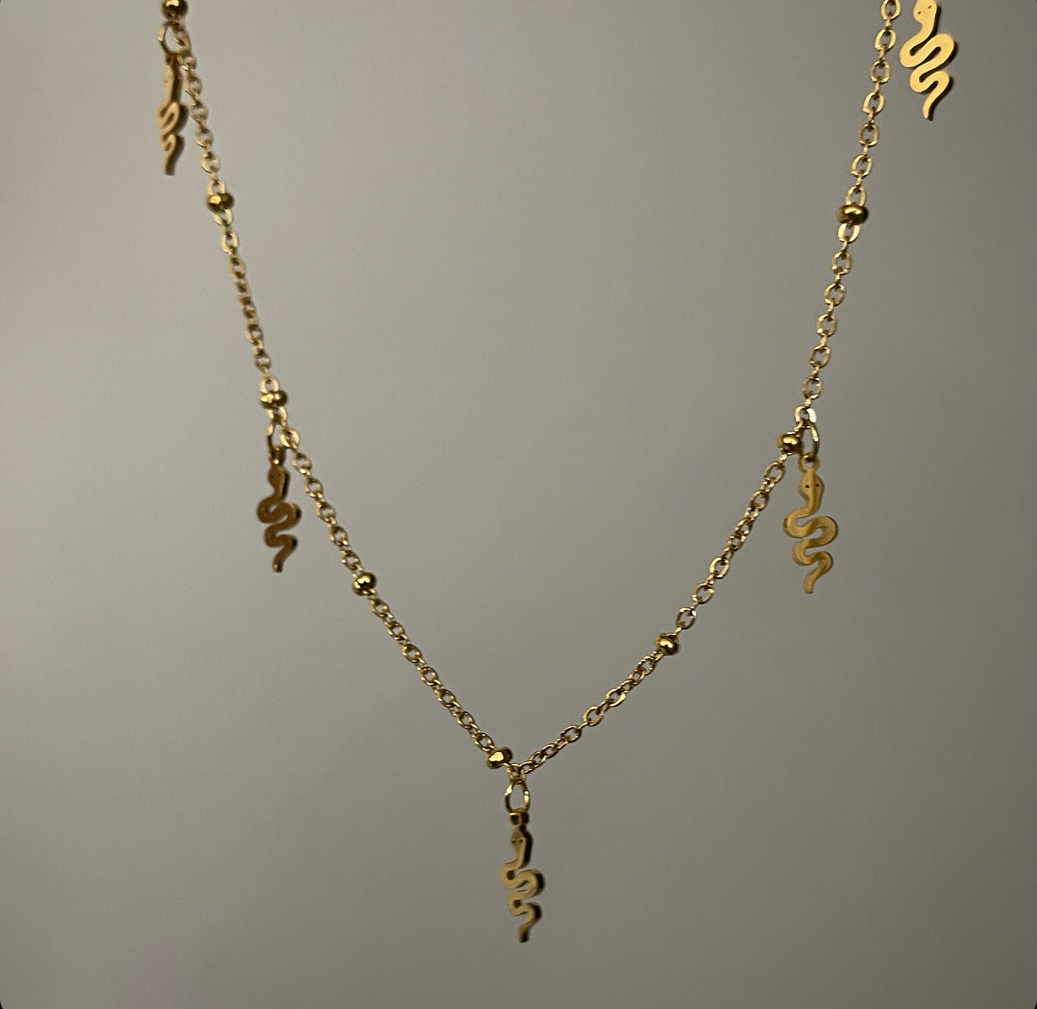 dangling snakes necklace